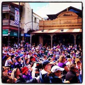 Crowds filling the street to watch the Grand Final on the big screen
